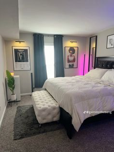 a bedroom with a large bed and pictures on the wall