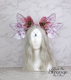 A real must-have statement crown for all fairies!  A beautiful pink magnolia flower fairy headdress. The wings are lightweight and far more durable than their glassy appearance might suggest! They are backed with wire, which is what gives them their gorgeous curve. They are flexible to touch, and may be very slightly adjusted to give a deeper/more shallow curve. The headdress is decorated with pink magnolia flowers and blossoms. Sparkling Swarovski beads hang over the forehead from a silver chai Fairy Wings Costume Cheap, Garden Fairy Costume Wings, Shop Fairy Wings, Head Accessories Wings, Pink Fairycore Dress For Garden Party, Pink Fairy Dress For Costume Party, Pink Fairy Dress For Garden Party, Pink Fairycore Dress For Costume Party, Whimsical Pink Crown Headpiece