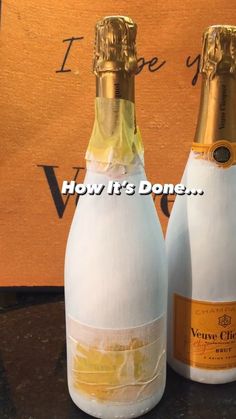 two bottles of champagne sitting next to each other