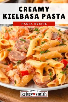 creamy kielbasa pasta on a white plate