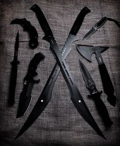 several different types of knives on a cloth