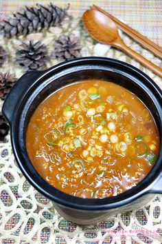 a bowl filled with soup on top of a table