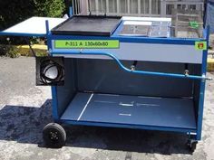 a blue cart sitting on top of a sidewalk