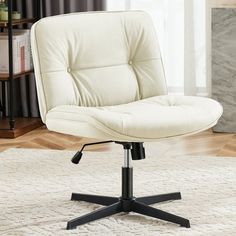 a white office chair sitting on top of a rug