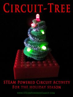 a christmas tree made out of legos with lights on it and the words circuit - tree