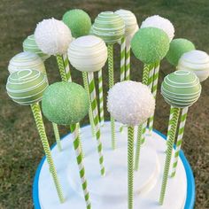 green and white cake pops on a blue plate