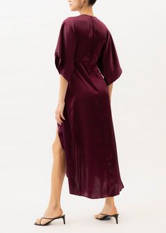 The Katherine is constructed from 100% silk and boasts a burgundy hue. It is designed with an empire waistline, a deep V-neckline with a concealed hook and eye closure, half kimono sleeves, and a wrap-style skirt, creating a delicate silhouette perfect for any special occasion. Jaline is made by women in NYC. The Katherine dress is one of our bestsellers as it fits all body shapes due to its empire-style waistline. As we cut to order we are happy to make small modifications for you, we can close Half Kimono, Katherine Dress, Burgundy Maxi Dress, Empire Waistline, Kimono Sleeves, Empire Style, Style Skirt, Kimono Sleeve, Plunging Neckline