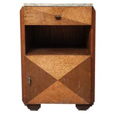 an old wooden cabinet with marble top