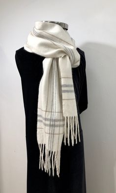 "Vintage - A soft, creamy white \"wooly\" scarf with muted grays and beige stripes along the length and a plaid of the same colors at each end - finished with a 4\" fringe. Cozy, comfortable and elegant - perfect for casual or evening wear * Man made fabric  * unisex  * lightweight * hand wash with cool water item # vsw 43 Please note: ALL my scarves have been carefully hand washed with mild soap, cool water & air dried for a pristine clean freshness and are in excellent condition." Beige Scarf, White Scarf, White Scarves, Grey Beige, Grey And Beige, Creamy White, Evening Wear, Scarf Wrap, Scarf Accessory