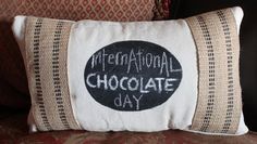 a pillow with the words international chocolate day written on it