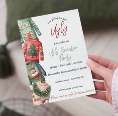 a person holding up a christmas party card