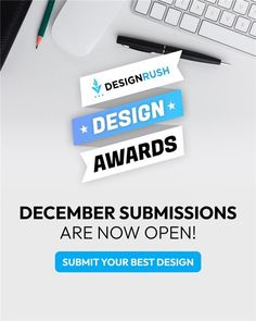 a desk with a keyboard, mouse and pen on it that says design awards are now open