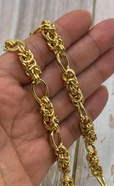 Elevate your jewelry collection with this large chunky Byzantine chain. Crafted from durable stainless steel, and PVD (Physical Vapor Deposition) vacuum plating. This stylish piece adds a bold and elegant flair to any look. Perfect for making a statement!  Each link is woven to create a timeless Byzantine pattern that exudes elegance. Available in increments of 1 foot.  Wheat Byzantine Chain Material: 304 Stainless Steel Finish: Gold Plated using PVD - explained below Size: 13 x 10mm  16 Gauge wire Unsoldered  Qty: 1 Foot It will be cut by continuous length unless requested otherwise What is PVD plating? The PVD (Physical Vapor Deposition) vacuum plating process is a cutting-edge technology that applies a durable layer of metal onto jewelry. By using a vacuum environment, metal particles a Gold Byzantine Jewelry With Box Chain, Yellow Gold Byzantine Jewelry With Box Chain, Byzantine Chain, Gold Byzantine Chain Jewelry, Gold Byzantine Tarnish-resistant Necklace, Byzantine Gold, Plate Size, Gold Plated Chains, Antique Gold