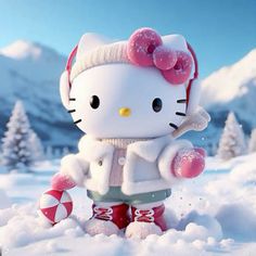 a hello kitty doll standing in the snow