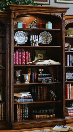 an old bookcase with many books on it