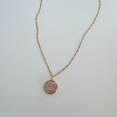 Elevate your style with our elegant rose quartz necklace. Perfect for the minimal and girly gal, this necklace exudes a subtle beauty that will make any outfit stand out. Let the calming energy of rose quartz inspire you to radiate confidence and grace. 18k Gold Filled, Brass, Rose Quartz Size: Chain- 18in w/ extender pendant- 23mm Tarnish-resistant, water resistant, and safe for sensitive skin Feminine Rose Gold Necklace With Adjustable Chain, Elegant Pink Round Charm Necklace, Elegant Pink Round Charm Necklaces, Elegant Pink Charm Necklaces With Delicate Chain, Elegant Pink Charm Necklace With Delicate Chain, Dainty Pink Necklace With Delicate Chain, Pink Delicate Charm Necklace With Delicate Chain, Delicate Pink Charm Necklace With Delicate Chain, Pink Dainty Pendant Crystal Necklace