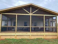 a screened porch with an attached deck