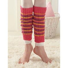 the legs of a woman wearing knitted leg warmers in red and orange stripes