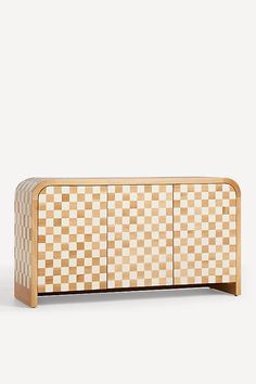 the sideboard is made out of wood and has a checkered pattern