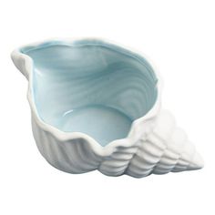 a blue and white bowl sitting on top of a table