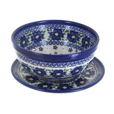 a blue and white bowl sitting on top of a plate