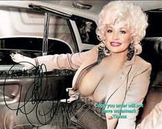 a woman sitting in the back seat of a car with her hand on the door handle