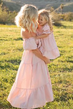 mother and daughter hugging in the field