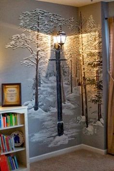 a room with a large mural on the wall and a book shelf in front of it