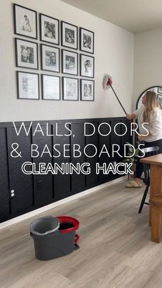 a woman is cleaning the floor with a mop and bucket in front of her