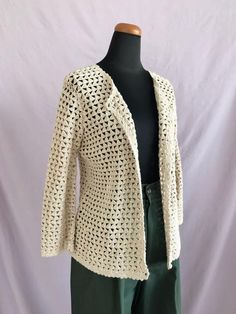 FREE SHIPPING on orders $35 and up.10% OFF when ordering 3 or more items (code: BUNDLE).Casual Corner Annex Beige Crochet Cardigan, Vintage Cardigan, Beige Knitted Blouse, Beige Crochet Top, Button Up Knitted Top, Vintage StyleDescription:-scalloped edges all around cardigan-crochet buttonsTag Info:(Brand) Casual Corner Annex(Material) 55% ramie / 45% cotton(Tag Size) MMeasurements (measured flat across):(Chest) 18"(Waist) 17"(Sleeve) 18"(Length) 22"Condition:In EXCELLENT vintage condition.  NO Cream Long Sleeve Cardigan With Crochet Lace, Long Sleeve Knit Cardigan With Crochet Lace, Fitted Beige Crochet Cardigan, Cream Long Sleeve Crochet Lace Cardigan, Long Sleeve Crochet Lace Knit Cardigan, Spring Cream Knitted Cardigan, Beige Crochet Knit Cardigan, Vintage Ring Dish, Blue Planter