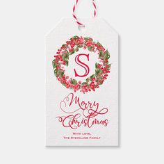 a christmas gift tag with the letter s on it and holly wreaths around it