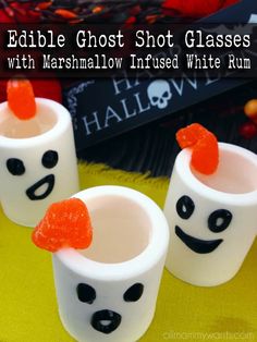 three marshmallow cups with faces painted on them and the words edible ghost shot glasses