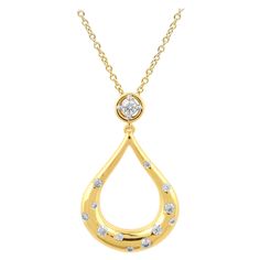 Elegantly designed diamond teardrop pendant will make your feel special and stand out. The pendant is crafted from 14 karat Yellow gold, and features 13 Round diamond set in prong and flush setting, H-I color I2 clarity and a high polish finish complete the Brilliant sophistication of this head-turning pendant. The total diamond weight 0.33 Carat and this Pendant suspends along with an 18 inches cable chain. Flush Setting, Art Deco Pendant Necklace, Yellow Gold Solitaire, Round Diamond Setting, Diamond Jewel, Antique Pendant, Contemporary Pendant, Modern Necklaces, Teardrop Pendant