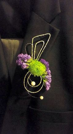 a close up of a tie with flowers in the shape of a trellis on it