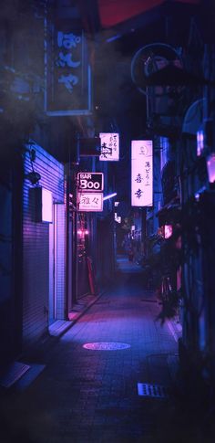 an alley way with signs lit up at night