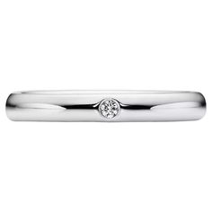 Item Specifications: Brand: Tiffany & Co. Model: Classic Wedding Band Metal: Platinum Metal Purity: 950 ​ ​Diamond Carat Weight: 0.02 ​ ​Diamond Color: F-G ​ ​Diamond Clarity: VS Ring Width: 2.76 mm Ring Thickness: ~1.92 mm Ring Size: 4 (Resizable) Total Weight: 4.9 Grams Condition: Excellent ​ ​Retails at $1350 100% Authentic Tiffany & Co. Tiffany Couple Ring Wedding Bands, Formal White Gold Solitaire Stackable Rings, Formal Stackable Rings With Single Diamond, Formal White Gold Stackable Rings With Round Cut, White Gold Stackable Rings For Formal Occasions, Wedding Band With Single Diamond, Formal Diamond Solitaire Couple Rings, Formal Solitaire Diamond Couple Rings, Luxury Stackable Wedding Rings With Single Diamond