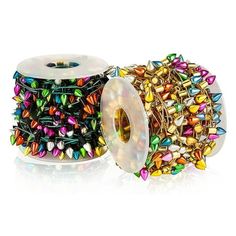 two spools of multicolored beads are next to each other