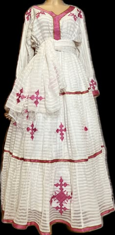 Beautiful Ethiopian and Eritrean Habeshan Dress. Stylish Menen, 100% Cotton We recommend hand washing and air drying to make it last longer. A low heating iron will also keep design and look. Cotton, it doesn't have a pocket. Traditional Ethiopian Dress, Habesha Kemis Ethiopian Dress, Acidity Remedies, Ethiopian New Year, Habesha Clothes, Ethiopian Wedding Dress, Eritrean Clothing, Eritrean Dress