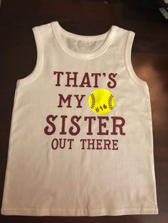 a tank top that says, that's my sister out there with a softball on it