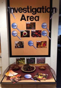 a table with food on it in front of a sign that says investigating area and magnifying images