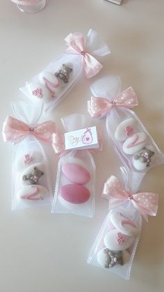 small packages with pink and white candies in them