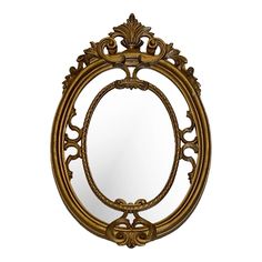 an ornate gold mirror is shown against a white background with the reflection of it's frame