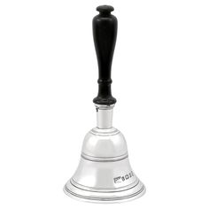 a silver bell with a black top on a white background