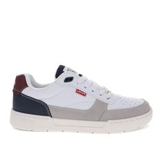 a white and grey sneaker with red, blue, and gray accents on the sole