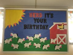 a bulletin board with sheep, barn and sun in the background that says herd it's your birthday