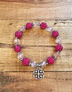 "This listing is a wonderful, bright, shiny pink glass beads and magenta shamballa beads bracelet is just gorgeous! If you like bling, this bracelet has it. It is made from glass beads, shamballa beads with silver (stainless steel) accent beads and a silver charm. It is elastic for the perfect fit and easy to put on. It is 7\" long. This is a bracelet you will love to wear!" Pink Crystal Bracelet With 8mm Beads For Party, Pink Charm Bracelet With 8mm Beads, Pink Beaded Rosary Bracelet With Round Beads, Pink Beaded Party Bracelets, Pink Beaded Rosary Bracelet, Pink Rosary Bracelet With Colorful Round Beads, Spiritual Pink Charm Bracelet With Round Beads, Spiritual Pink Beaded Bracelets With Large Beads, Adjustable Pink Rosary Bracelet With Faceted Beads