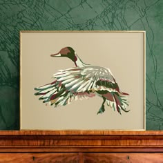 a painting of a duck is hanging on the wall next to a dresser in a room with green walls