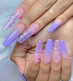 purple and pink stiled nails with stars on them, in the shape of an arrow