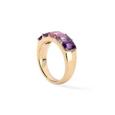 This ring is perfect for a lover of pink and purple hues! This 5 stone ring features one center pink sapphire flanked by light and dark amethyst stones set on a gold band. Embrace color and live vibrantly with this stunning ring! Available in 14K Yellow Gold Pink Sapphire weight = 0.72 carats Light and dark Amethyst weight - 2.20 carats Band width = 6.4mm and tapers to 3.4mm, based on a size 7 Gemstones are natural, therefore colors may vary Amethyst Ring With Pink Sapphire Center Stone For Anniversary, Three Stone Amethyst Ring In Yellow Gold, Purple Three Stone Fine Jewelry Rings, Yellow Gold Three Stone Amethyst Ring, Purple Pink Sapphire Promise Ring, Purple Pink Sapphire Ring With Center Stone, Elegant Purple Multi-stone Birthstone Ring, Pink Amethyst Ring In 14k Gold, Pink Amethyst 14k Gold Ring Gift