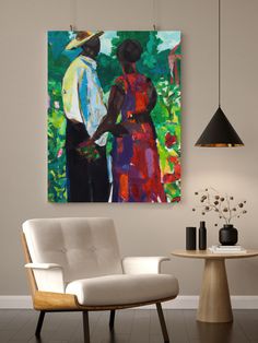 two people standing next to each other in front of a painting